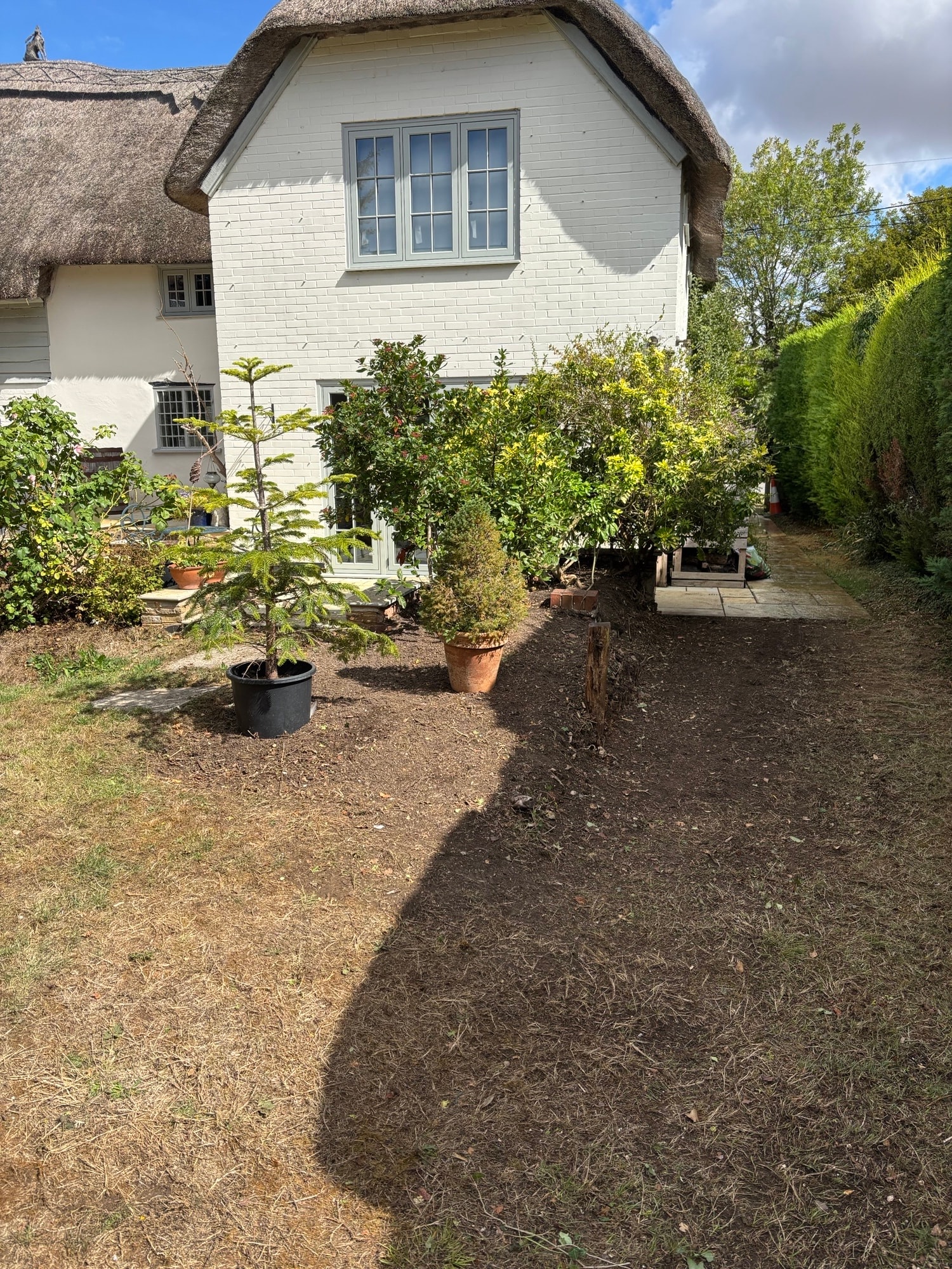 Cleared cottage garden after Open Ground clearance — ground cleared and tidy
